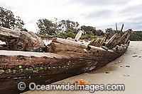 Historic Shipwreck 'Buster' on Woolgoolga beach, New South Wales. Vessel was blown ashore & beached during a violent storm in Feb 1893. Class: Barquentine. Construction: Timber single deck & 3 masts. Built: Nova Scotia, Canada 1884. Length - 129 ft
