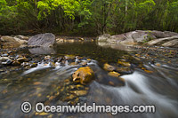Rocky water rapids in the Never Never River, situated in the Promised Land, near Bellingen, New South Wales, Australia.