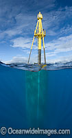 A massive wave energy buoy off Kaneoho Bay, Oahu. The 40-kW experimental buoy, employs the bobbing motion of the buoy to drive an electrical generator, that then sends power to the island via underwater cable, Hawaii.