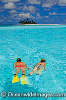 Snorkelers at tropical Island Photo - Gary Bell