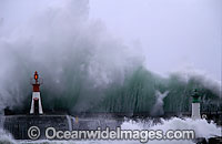 Wave breaking over wall Photo - Chris and Monique Fallows