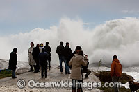 Huge wave breaking over rock Photo - Chris and Monique Fallows
