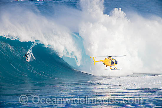 Helicopter filiming surfer Hawaii photo