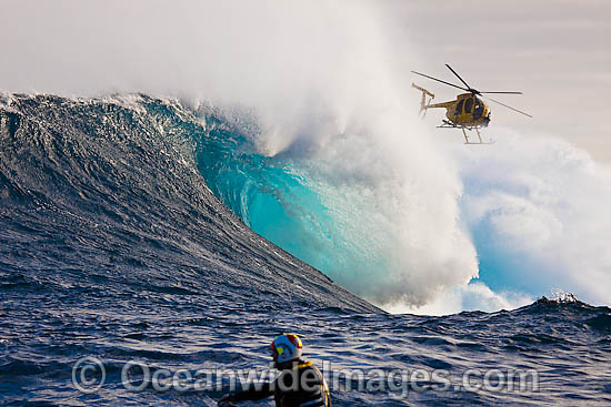 Helicopter filiming surfer Hawaii photo