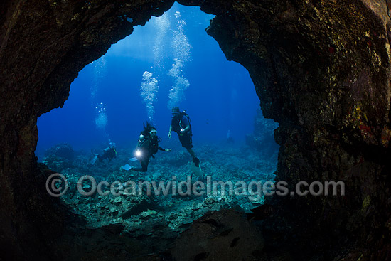 Divers explore lava tube photo