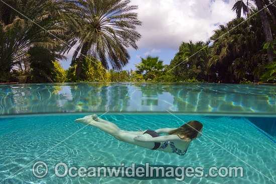 Girl swimming in pool Caribbean photo