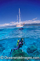 Scuba Diver beneath sailing yacht Photo - Gary Bell