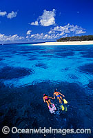 Snorkelers in island lagoon Photo - Gary Bell