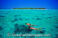 Snorkellers on coral reef Photo - Gary Bell
