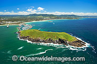Aerial view of Coffs Harbour, situated on the northern New South Wales coast, showing Mutton Bird Island, protected boat harbour with jetty, Coffs Harbour township and mountain range. Coffs Harbour, Australia.