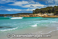 Lichen covered granite boulder coastline. Bay of Fires, Tasmania, Australia.