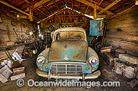 Old Morris Minor in a farm shed. Near Bicheno, Tasmania, Australia.
